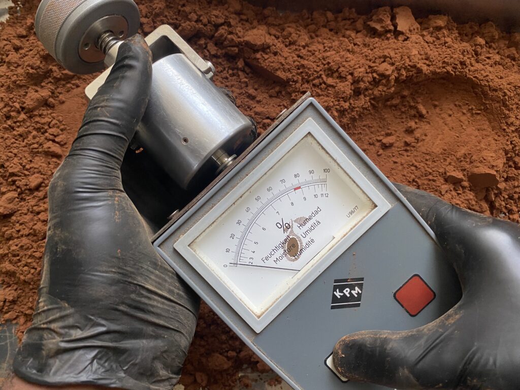 Hands Holding Moisture Meter Testing Tanzania Cocoa Natural Cocoa Powder