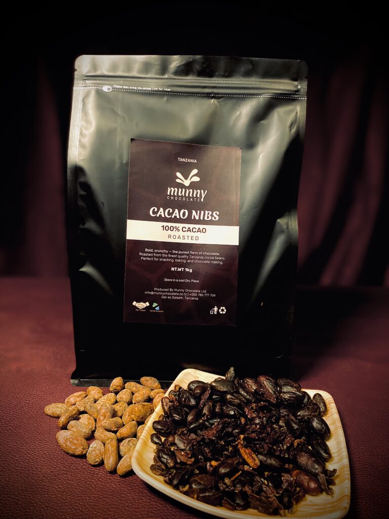 Roasted cacao nibs pouch with wooden plate of nibs Tanzania