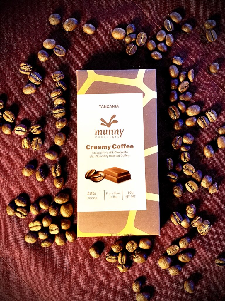 Creamy Coffee 45% Tanzanian Milk Chocolate bar surrounded by coffee beans